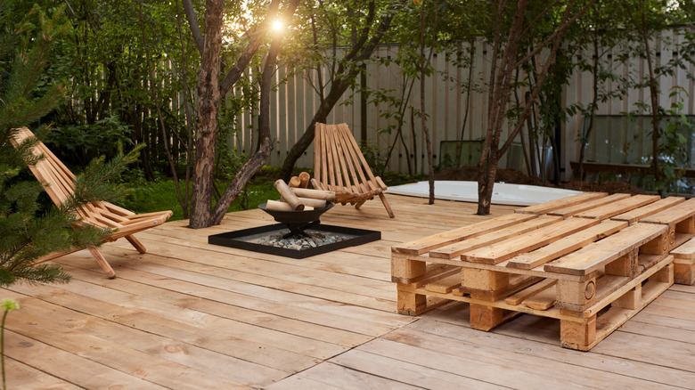 wooden deck with fireplace