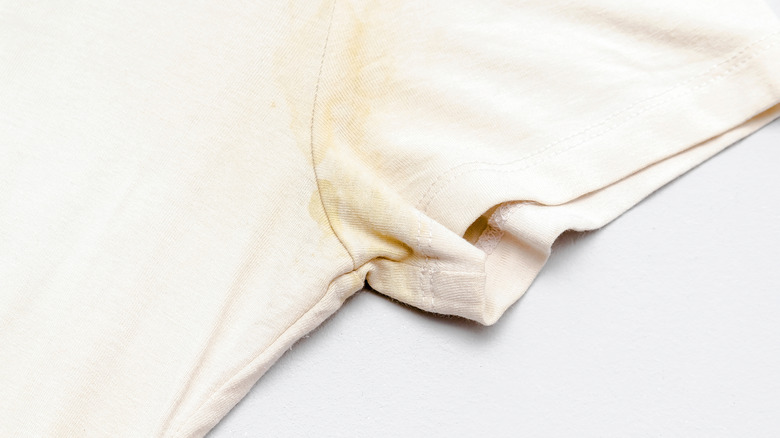 Close-up of sweat stain on white shirt