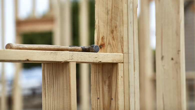 Hammer laying on a 2X4