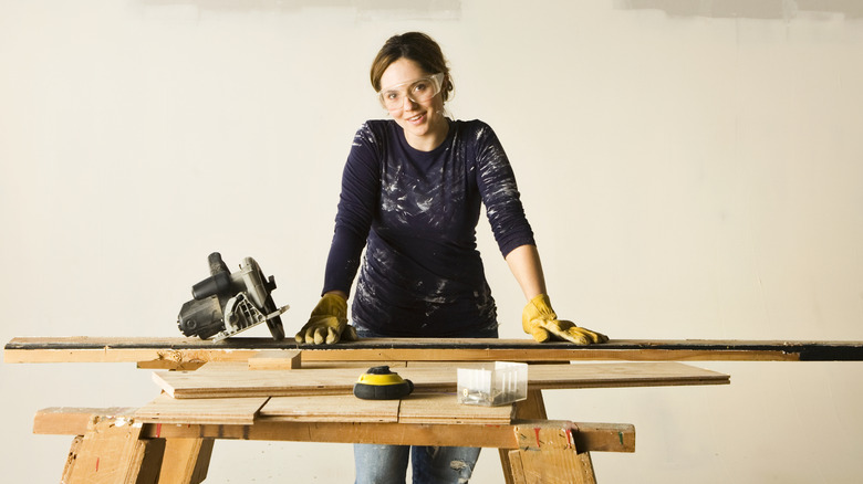 young woman with circular saw