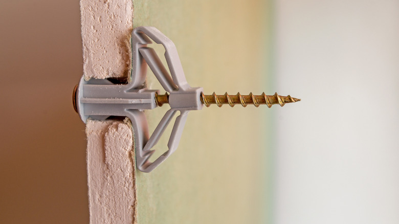 drywall anchor coming out wall