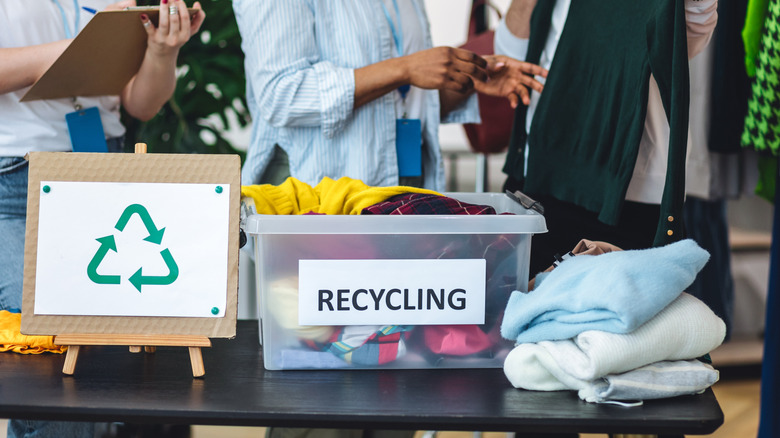 A bin of textiles for recycling