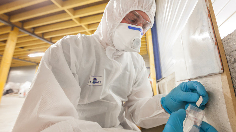 Taking a sample during an inspection for asbestos