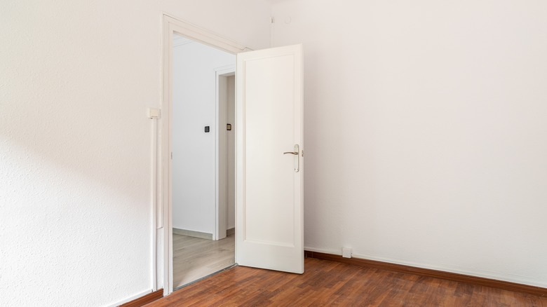 undecorated kids bedroom with white walls