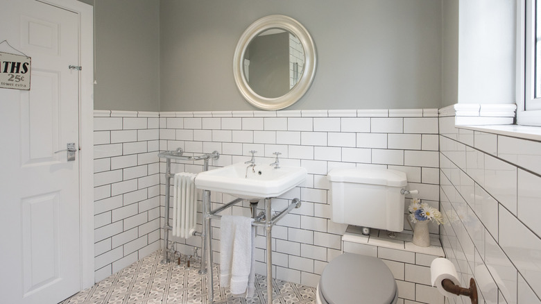 white and grey outdated bathroom