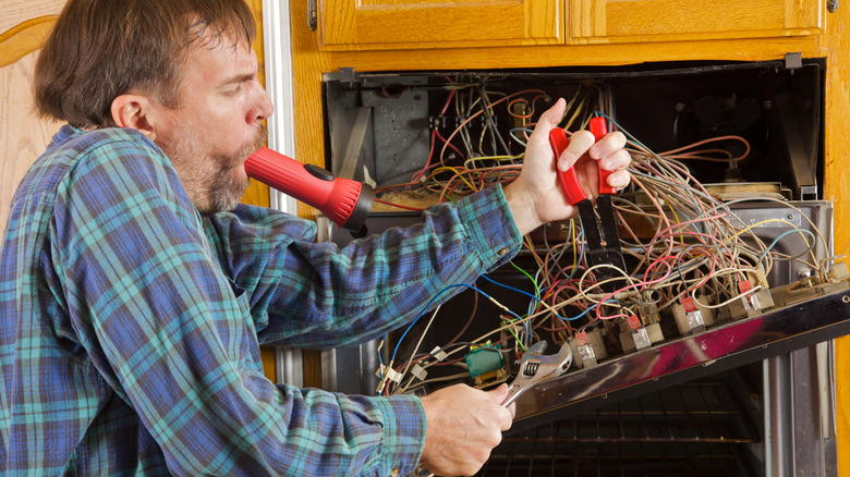 man doing complicated wiring project