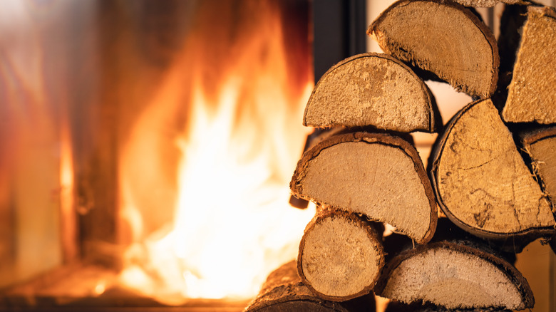 firewood stack in front of stove