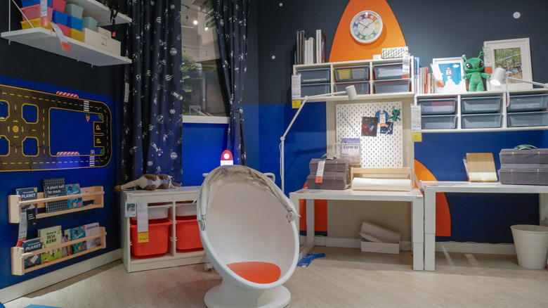 An Ikea showroom of a space-themed boys room