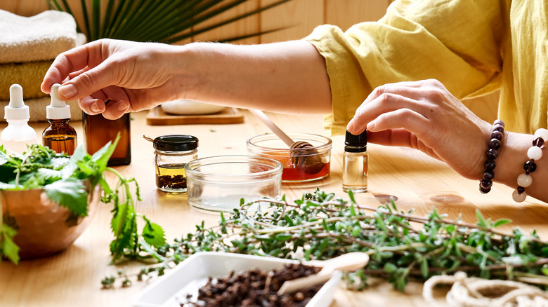 woman with herbs and oils