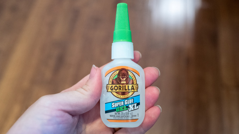 hand holding gorilla glue