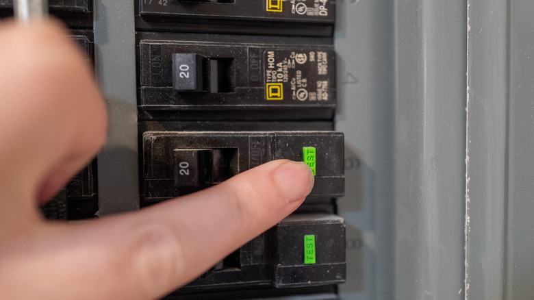 Pressing the "test" button on a GFCI circuit breaker