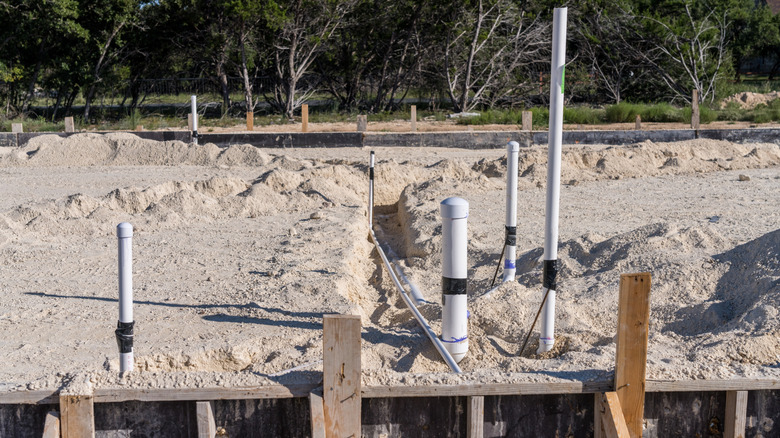 Plumbing roughed in beneath a home's slab