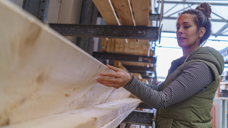 Woman selecting lumber