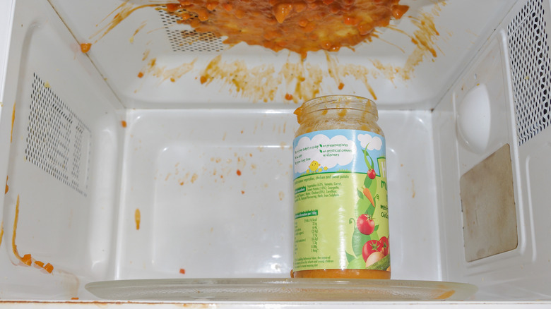 can of tomato sauce exploded in microwave with splatter on the ceiling