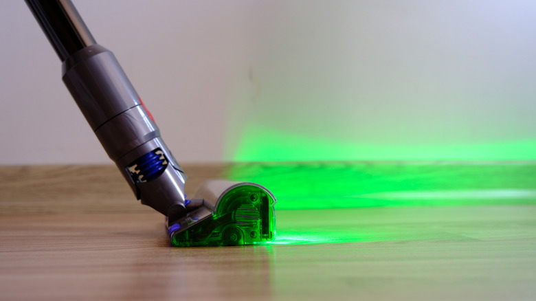 Dyson vacuum with green light coming from head