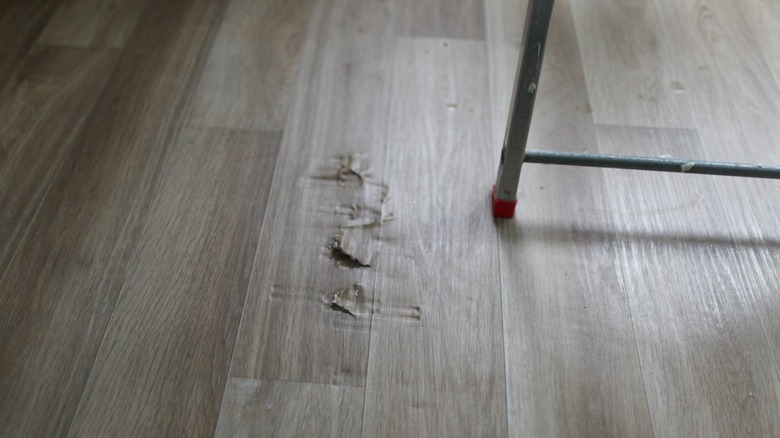 Peeling gray laminate flooring