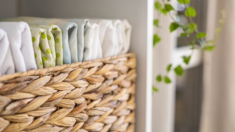 Linens folded neatly in basket