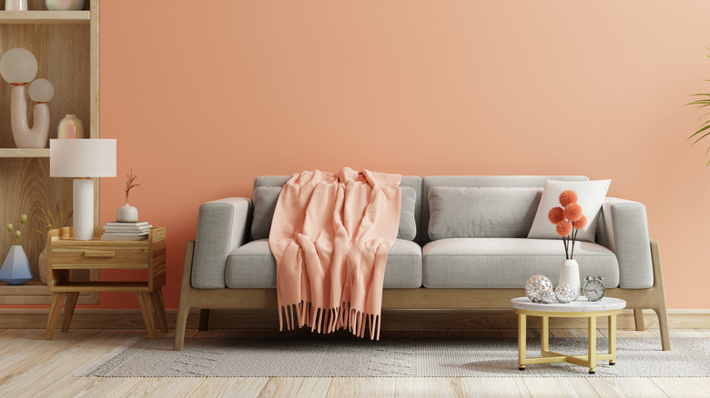 sofa in peach and gray colored living room