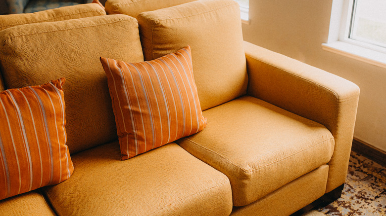 orange couch and pillows