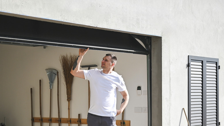 Man fixing garage door