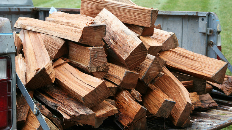 cut firewood in back of pick-up truck