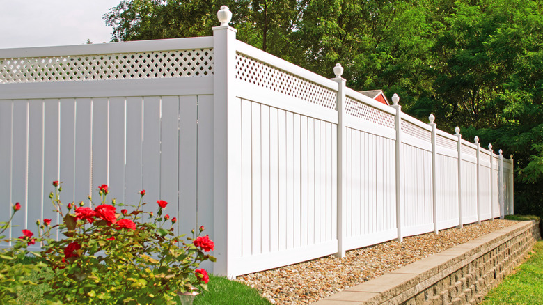 Vinyl fence with lattice top panel