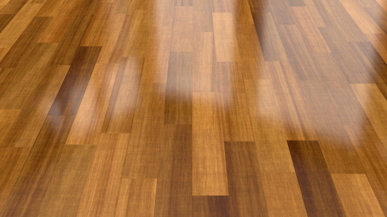 Polished wooden floor with reflections of light