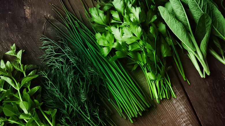 Freshly picked herbs on a wooden table