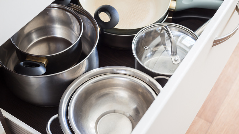 pots and pans in a drawer