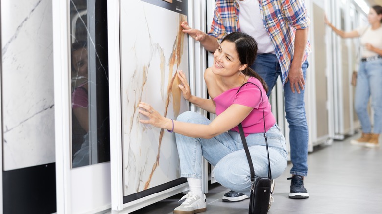 couple looking at large tile