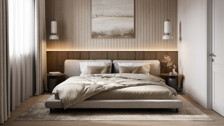 Modern bedroom with wall-to-wall lit headboard