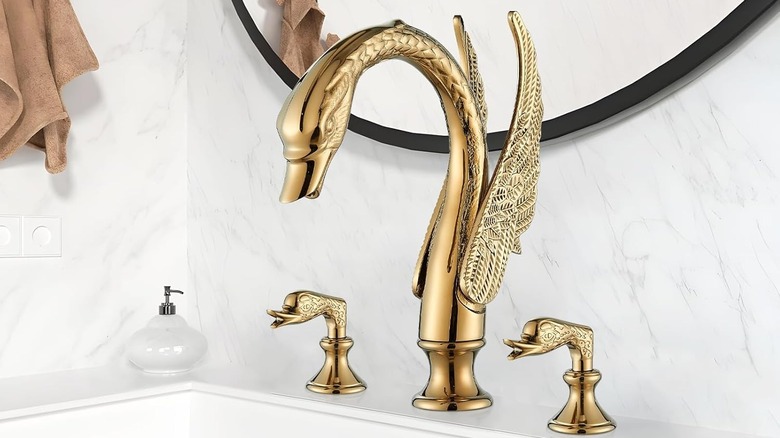 bathroom with brass swan faucet