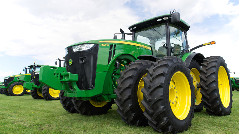 john deere tractors in field