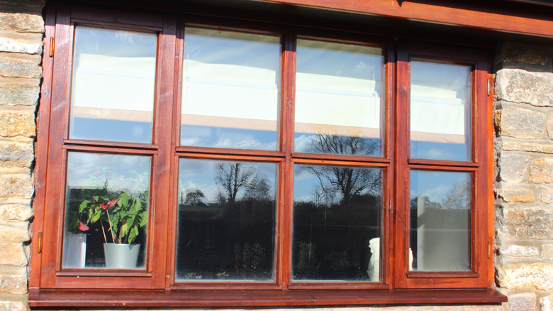 varnished window sills in a pained window from the outside