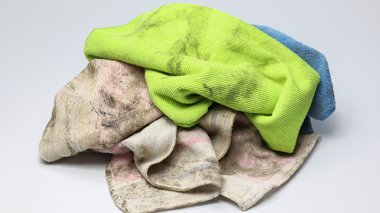 pile of dirty towels of various colors