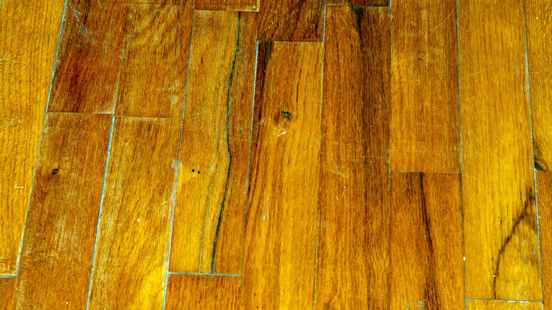 close up of dull, scratched hardwood floor