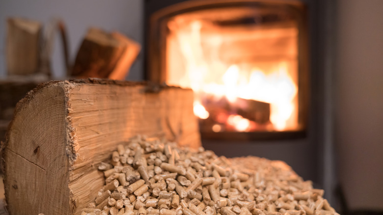 wood and wood pellets in front of a fireplace